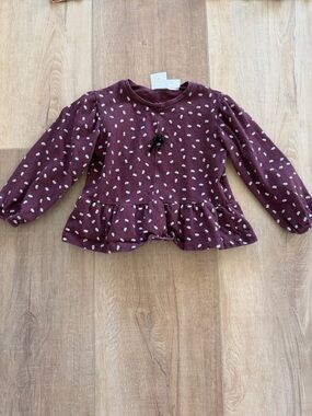 Floral peplum long sleeve tee